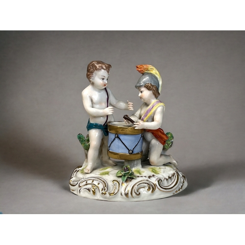 462 - A German Hochst porcelain figure group.Marked to base.Height - 15cm