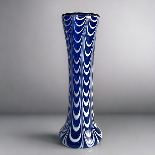 187 - A scarce Nailsea art glass vase.Circa 1900.White overlay pulled design.Height - 23cm... 