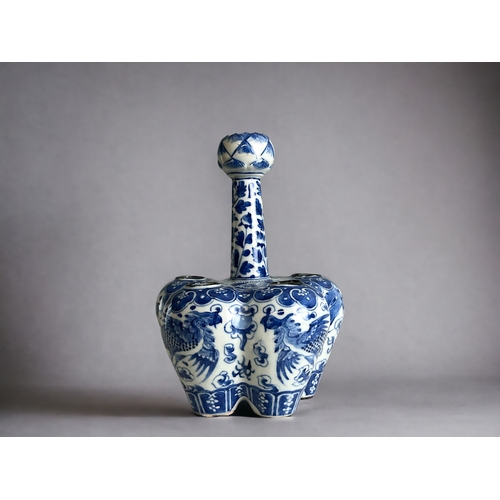 13 - A Chinese blue & white Tulip bulb vase.Qing dynasty. The lobed body, hand painted with a pair of... 