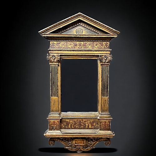 124 - A North Italian Renaissance mirror.16th Century, Tuscany.Tabernacle form. Carved giltwood with Corin... 