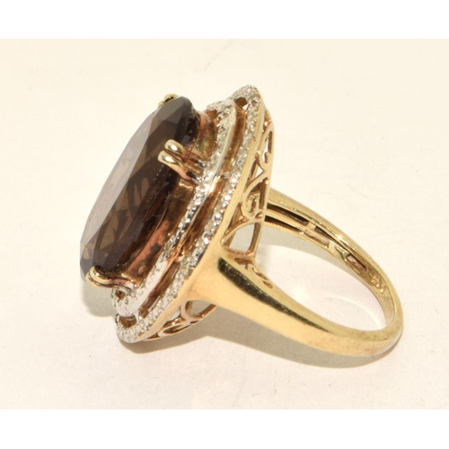 486 - 925 silver statement ring designed around a large central  stone in a open work halo design size M