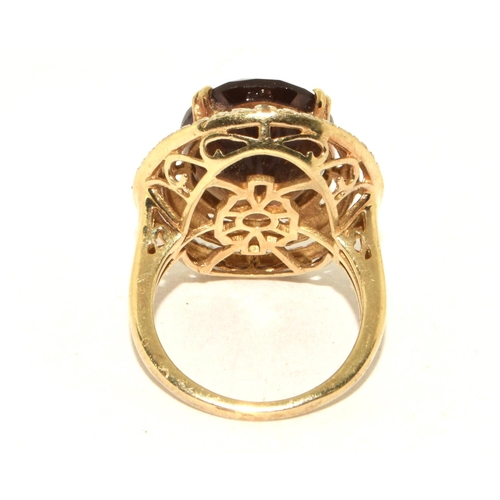 486 - 925 silver statement ring designed around a large central  stone in a open work halo design size M