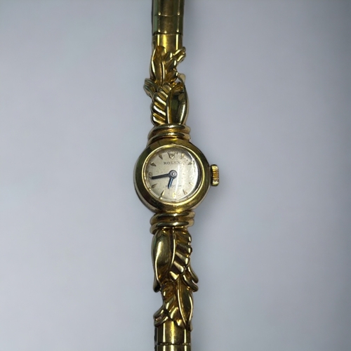 511 - 18CT GOLD LADIES ROLEX COCKTAIL WATCH. Circa 1958. With unusual 18ct gold 'leaf' design strap. Londo... 