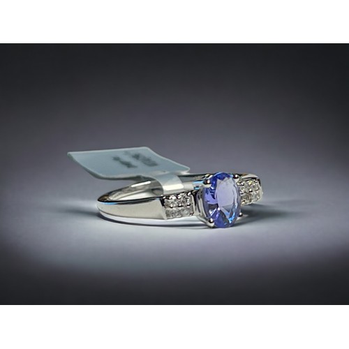 515 - A 9CT white gold & Tanzanite ladies ring. Set with an oval cut solitaire 0.75ct Tanzanite accent... 