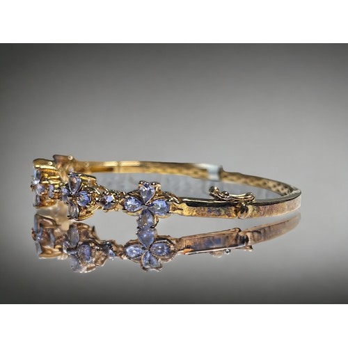 517 - A Tanzanite & 18ct gold plate in silver ladies bracelet.Set with total 2.81cts round & pear ... 