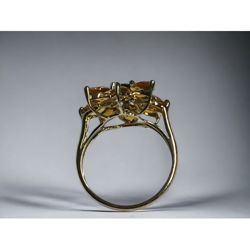 531 - A ladies 9ct Gold flower ring.Set with Citrine? & Smokey Quartz.Hallmarked. Size - M... 