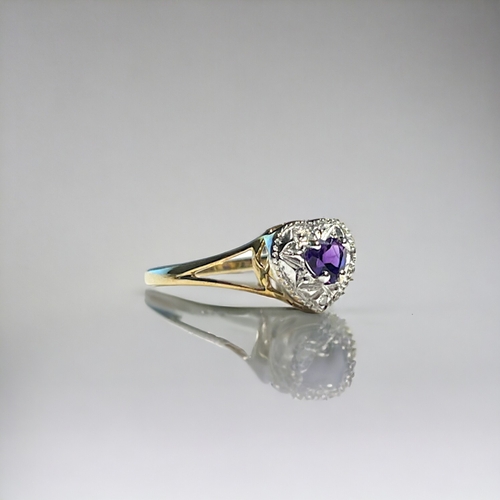 530 - A 9ct Gold & Amethyst 'heart' shape ring.Set with one small accent Diamond.Size M