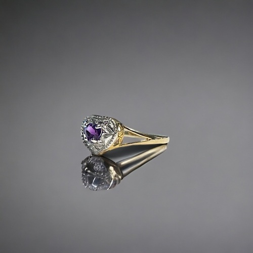 530 - A 9ct Gold & Amethyst 'heart' shape ring.Set with one small accent Diamond.Size M