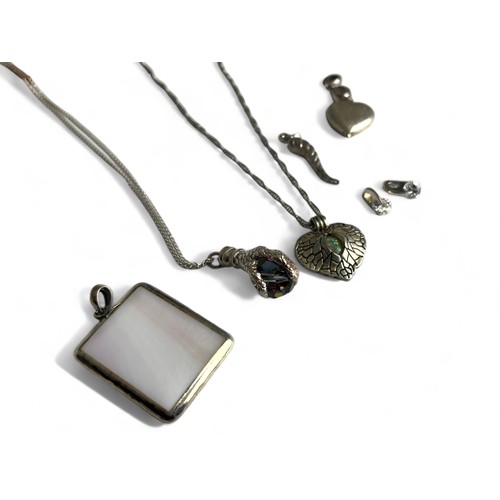 532 - A collection of various Silver & white metal pendants and chains.