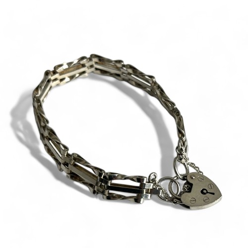 256 - A sterling silver gate link bracelet.