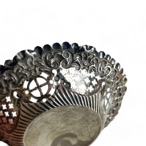 263 - A pair of Sterling silver pierced Bon Bon dishes. Together with a sterling silver condiment base. Bo... 