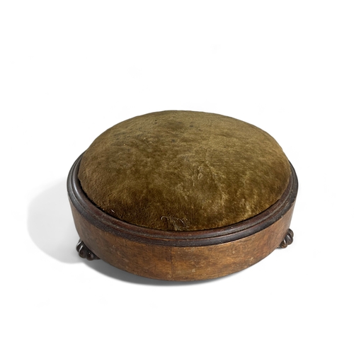 204 - A 19th century Walnut footstool. With three glazed ceramic feet.13 x 29 cm