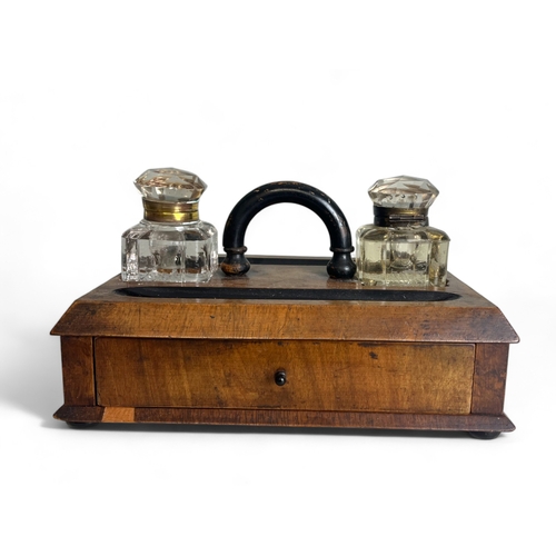 269 - A late Victorian ebonised Ink stand. With crystal ink wells.