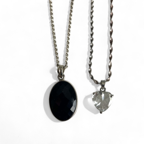 536 - A silver and facet cut black onyx cabochon pendant necklace. together with a gold plated heart shape... 