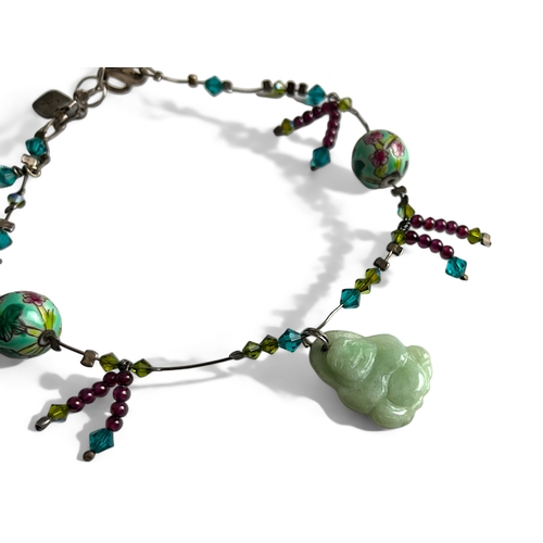 276 - A Chinese Charm anklet. Mounted with Jade Buddha, flower painted balls and glass beads.