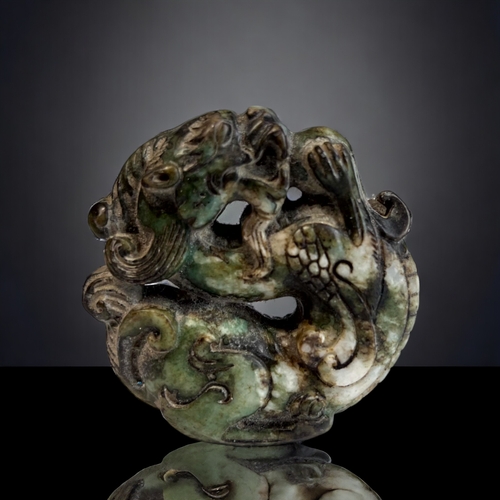 279 - A Chinese Carved Hardstone Dragon. Openwork circular Dragon with Pearl. Diameter - 5.5cm