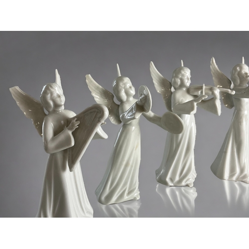 293 - A collection of eight Dresden porcelain angels.