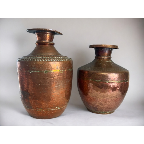 33 - Two Nepalese copper Gagri water pot.Early-mid 20th century. Tallest - 38cm