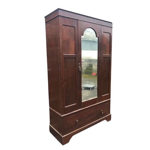 301 - Mahogany Wardrobe with central bevelled dressing mirror and drawer beneath. Approx 198cm x 119 x 45