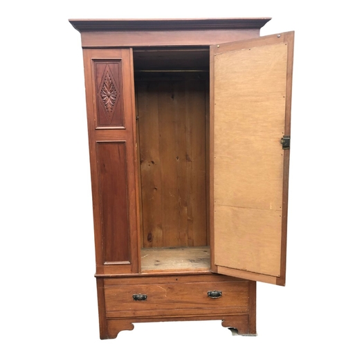 302 - Wardrobe with central bevelled dressing mirror and drawer beneath. Approx 203cms x 117 x 50