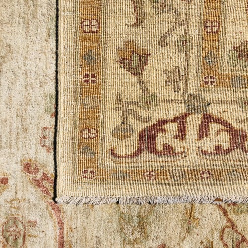 228 - Large 20th Century Pakistani Cream Ground Wool Rug.245cm x 180cm