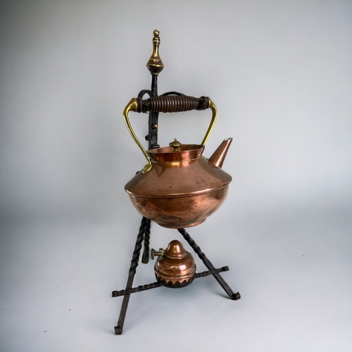 370 - A Victorian Copper & brass Spirit kettle.Attributed to Christopher Dresser. On Arts & Crafts... 