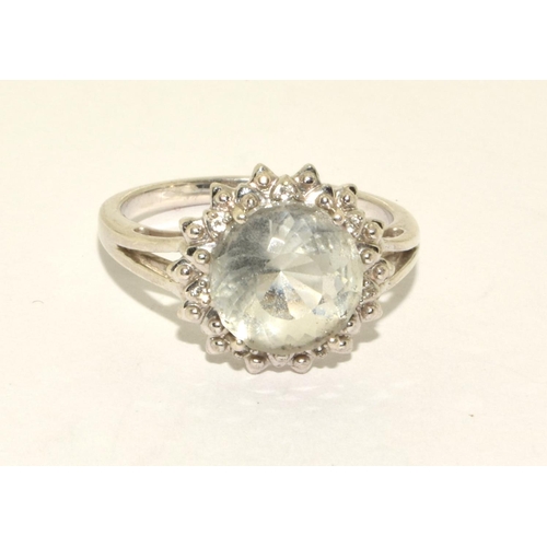 397 - 925 silver gemset ring in a halo design size R