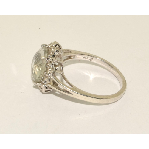 397 - 925 silver gemset ring in a halo design size R