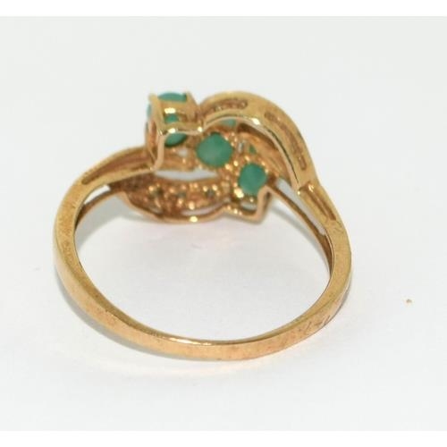 408 - 9ct gold ladies Diamond and Emerald sweep ring size N