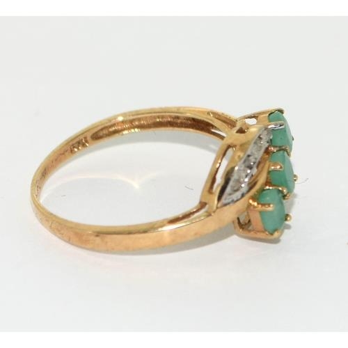 408 - 9ct gold ladies Diamond and Emerald sweep ring size N