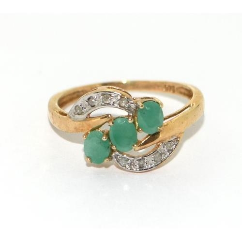 408 - 9ct gold ladies Diamond and Emerald sweep ring size N