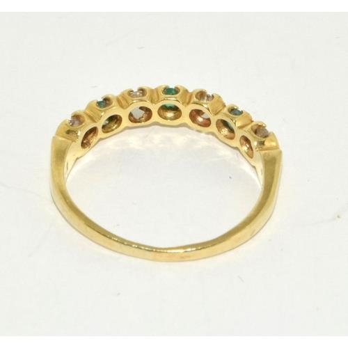 426 - Emerald and Diamond 1/2 eternity ring in 18ct gold ring Size O