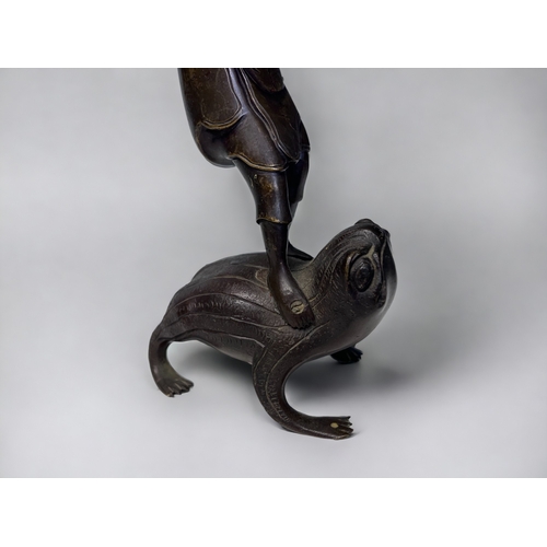 35 - A PAIR OF JAPANESE BRONZE OKIMONO. Meiji period. Depicting men stood on the backs of toads, carrying... 