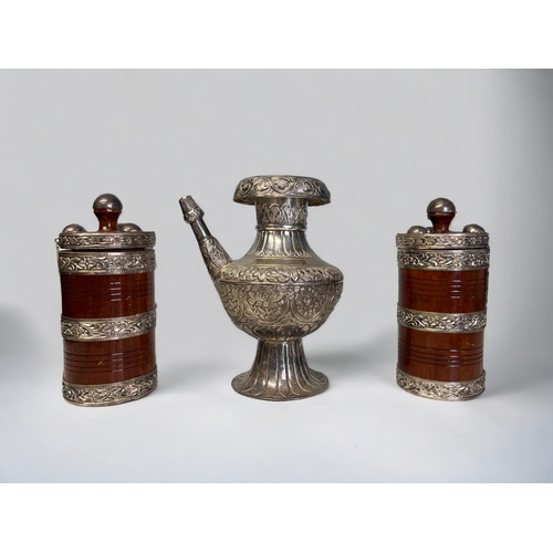 36 - A NEPALESE BUDDHIST EWER (KARUWA).
Together with two Gurkha ceremonial Ghee (Butter) boxes.