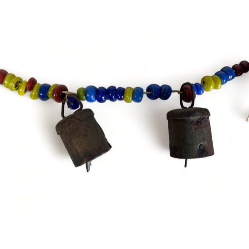 37 - ANTIQUE TIBETAN / INDIAN BEADED COW BELLS.
Strung with metal bells and multicoloured beads.