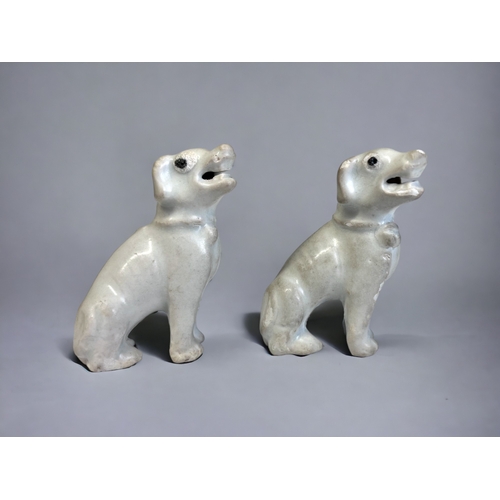 15 - A PAIR OF CHINESE DEHUA PORCELAIN DOGS. Qing dynasty, Kangxi period (1662-1722) Modelled as seated d... 