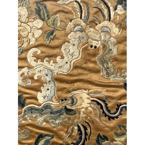 6 - A CHINESE SILK EMBROIDERY PANEL. Qing dynasty. Depicting stylised Phoenix amongst Peonies. Border pa... 