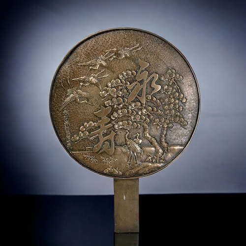 79 - A JAPANESE BRONZE HAND MIRROR.
Depicting Cranes & cherry tree scene.
Signed to lower left. 
Height -... 