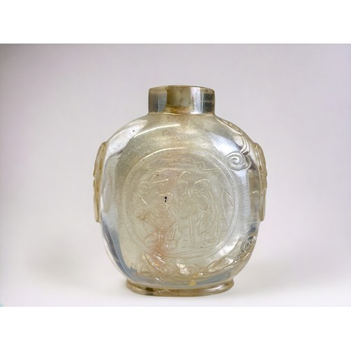 103 - A Chinese carved Rock crystal snuff bottle. Qing dynasty, 19th century. Skilfully carved roundels on... 