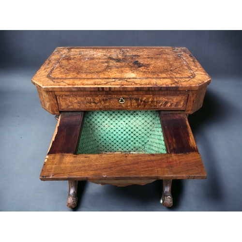 128 - A VICTORIAN BURR WALNUT WORK TABLE. Carved legs raised on original casters. Joined by turned wood st... 