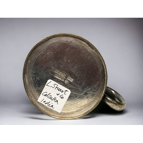 738 - A 19th century small tankard.
L. Stewart & Co, Calcutta, India.
Engraved design.
Height - 6.5cm