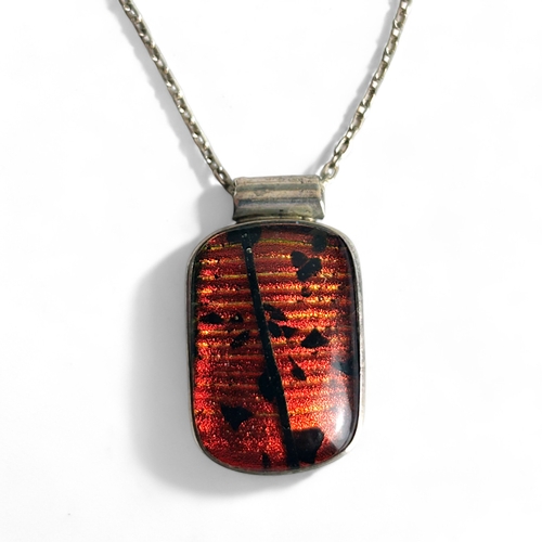 401 - A silver Dichroic glass pendant necklace.Stamped '925'.