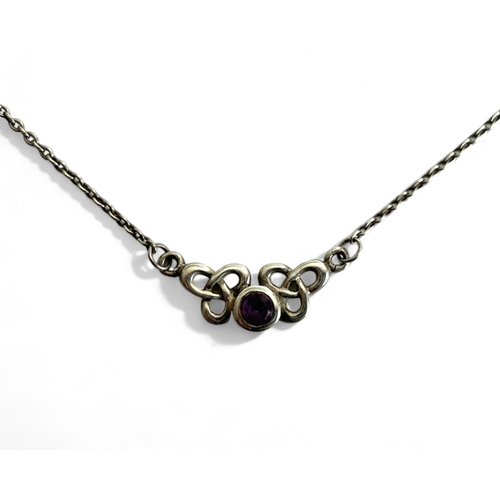 402 - A silver & purple Gem 'Celtic' design necklace.