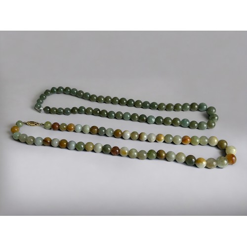 406 - Two polished Agate bead necklaces. One with silver gilt clasp.