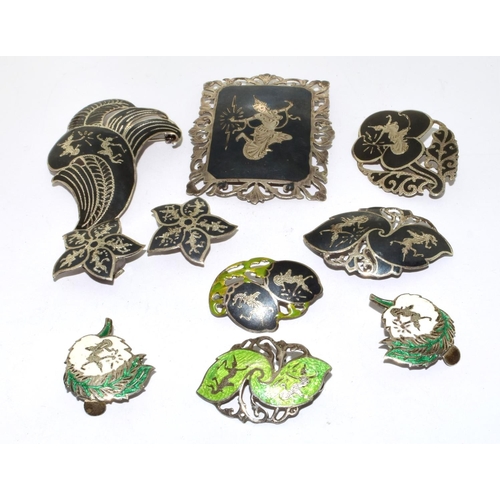 422 - Collection of Siamese silver brooches and earrings 