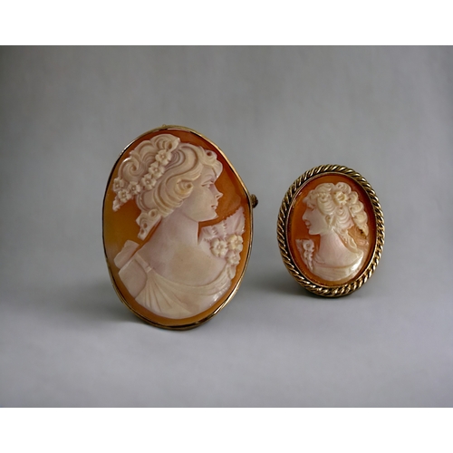 399 - Two vintage yellow metal carved Cameo brooches.