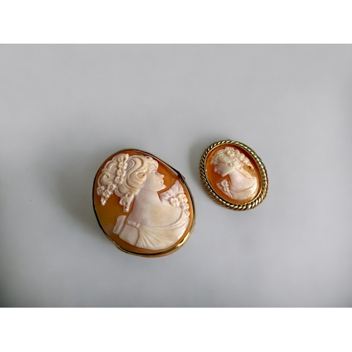 399 - Two vintage yellow metal carved Cameo brooches.