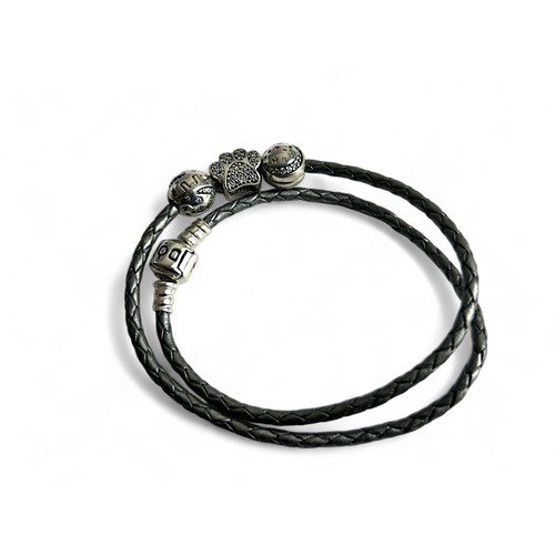 398 - A boxed Pandora bracelet with charms.