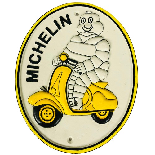 370 - Cast metal Michelin man on a scooter sign ref 114