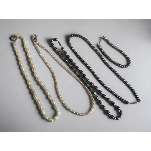 377 - Four strings of Pearl necklaces and one similar bracelet.